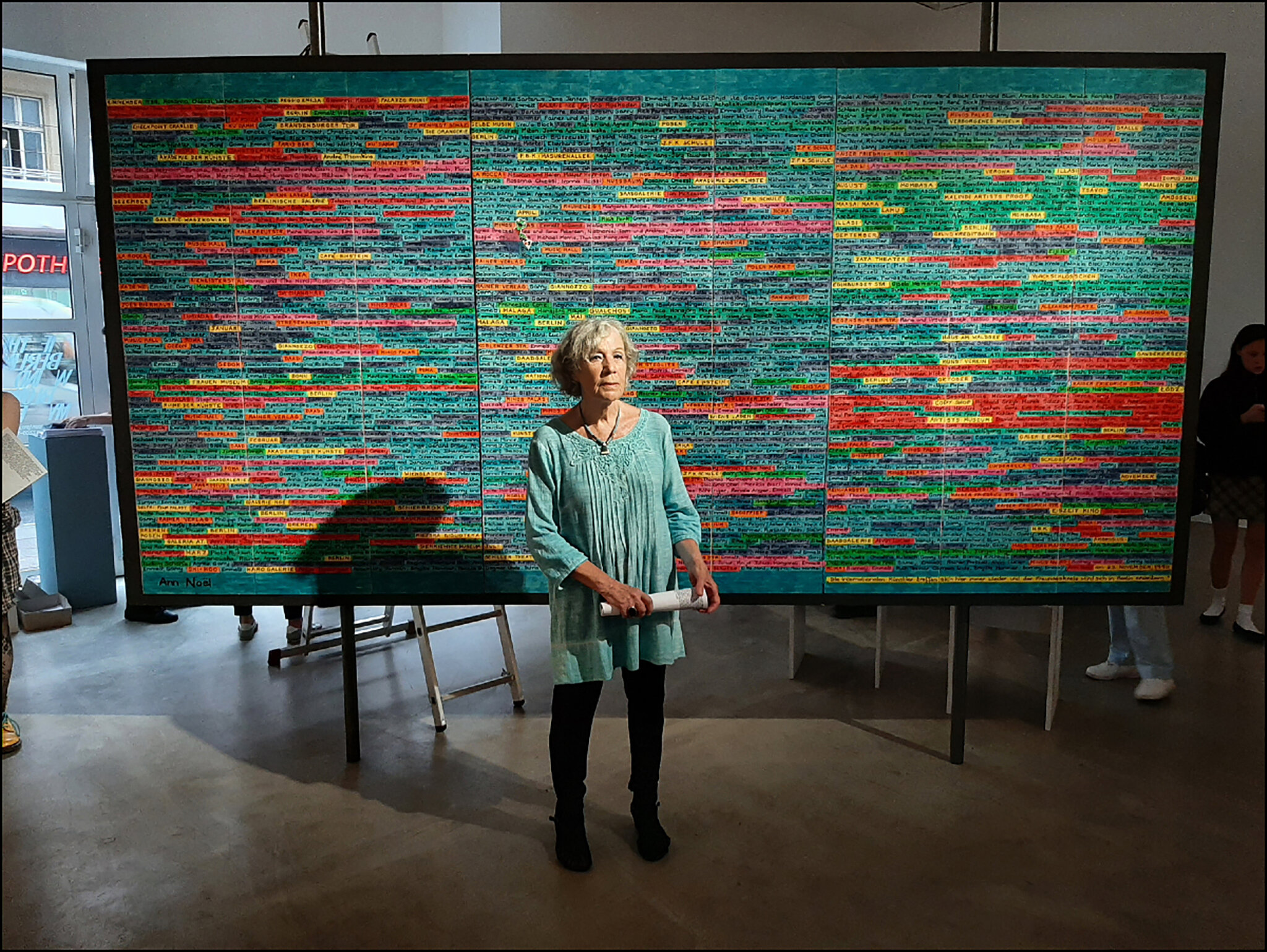 Ann Noel standing in front of her work